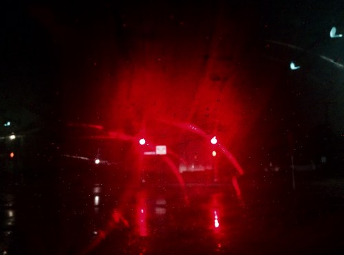 STOP grossly exaggerated by rain-soaked asphalt. 